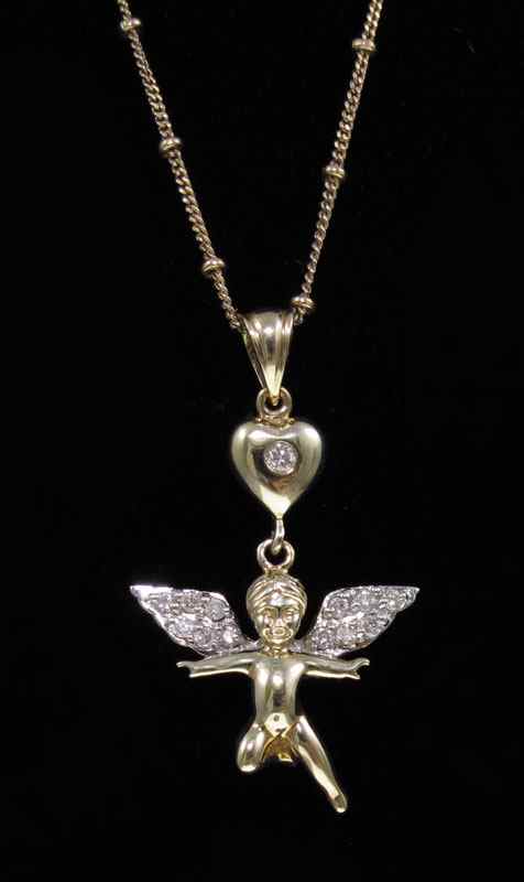 Appraisal: K DIAMOND ANGEL PENDANT NECKLACE K yellow gold necklace depicts