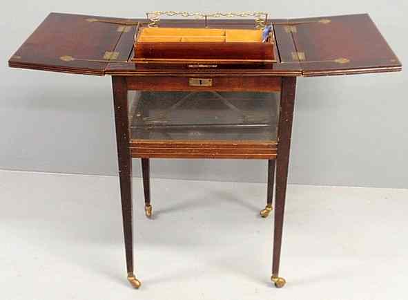 Appraisal: Unusual mahogany and glass sided tantalus table mid th c