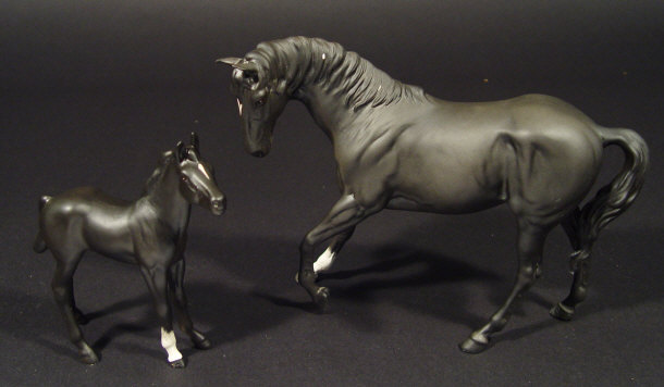 Appraisal: Beswick Black Beauty horse and a similar foal with hand