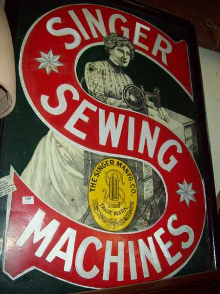 Appraisal: A SIGNER SEWING MACHINE FRAMED ENAMEL SIGN