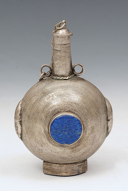 Appraisal: AN INDO-PERSIAN SMALL SILVER METAL PILGRIM FLASK with two lapis