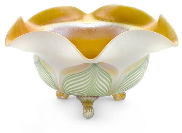 Appraisal: An American decorated iridescent glass footed bowl attributed to Quezal