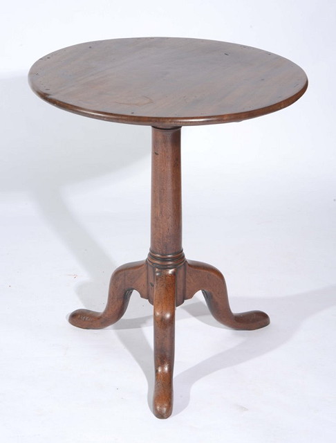 Appraisal: A GEORGE III MAHOGANY CIRCULAR TRIPOD TABLE with gun barrel