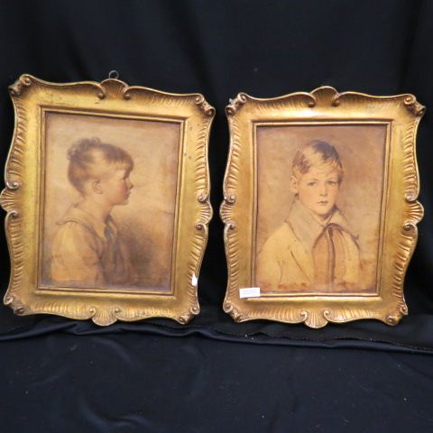 Appraisal: Pair of Gold Decorated Plaster Plaques boy girl