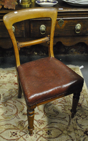 Appraisal: Four Victorian semi-balloon back dining chairs on turned supports