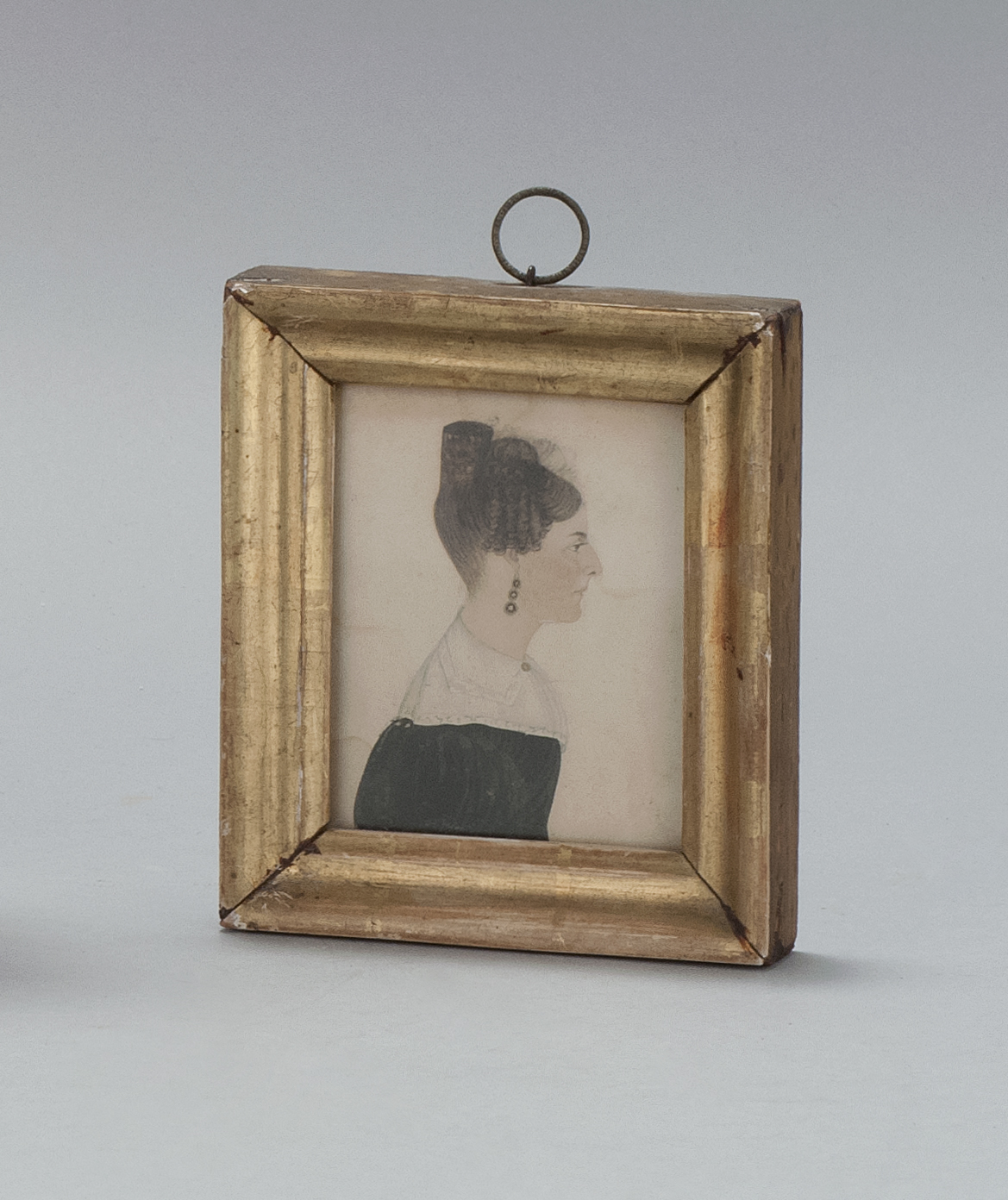 Appraisal: MINIATURE PORTRAIT OF A WOMAN American Dated Side view bust