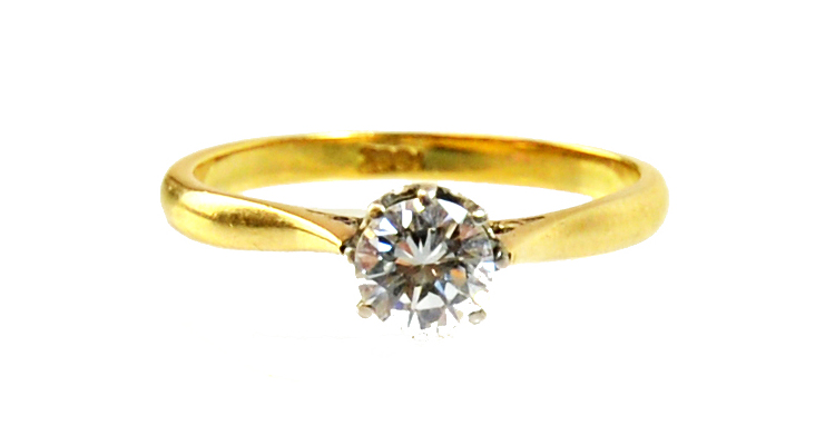 Appraisal: A gold and diamond set single stone ring claw set