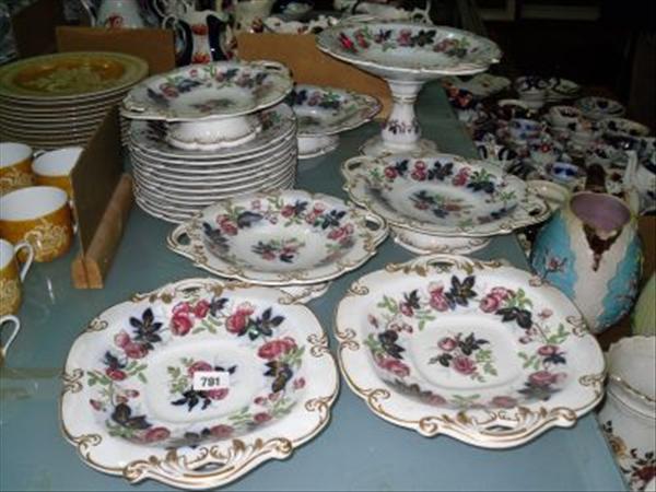 Appraisal: A th century ironstone part dinner service decorated in red