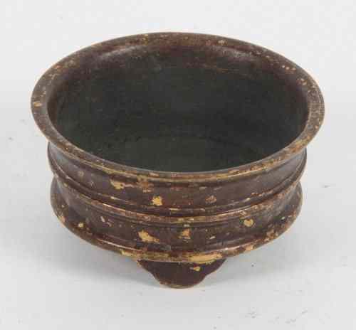 Appraisal: A Chinese bronze circular bowl with gold splash decoration on