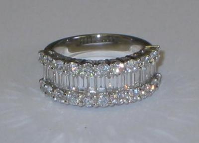 Appraisal: A DIAMOND FANCY HALF ETERNITY RING comprising baguette cut diamonds