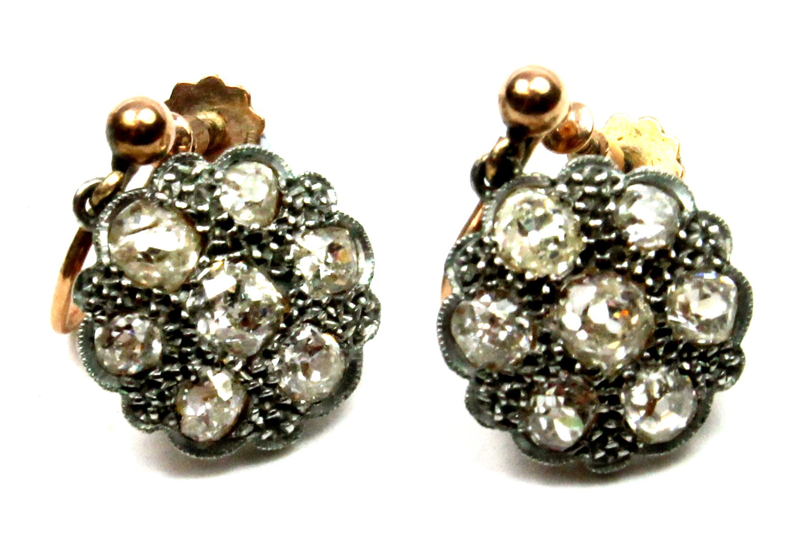 Appraisal: A pair of diamond set seven stone cluster earrings each