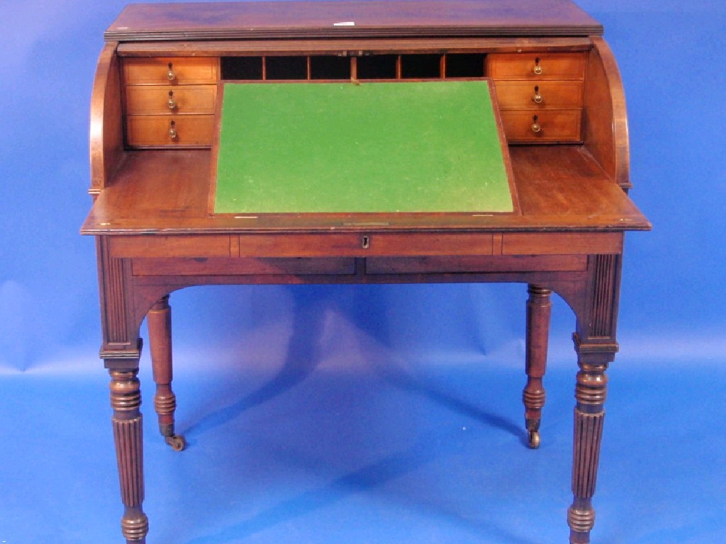 Appraisal: A late George III mahogany cylinder writing bureau with reeded