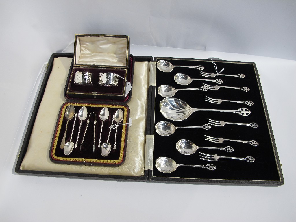 Appraisal: A lot comprising a cased pair of silver napkin rings