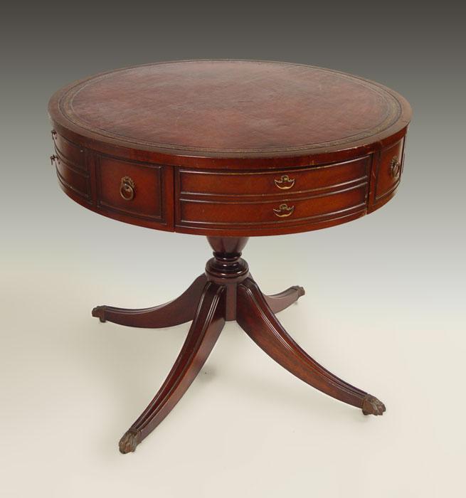 Appraisal: MAHOGANY LEATHER TOP DRUM TABLE Gold embossed leather top single