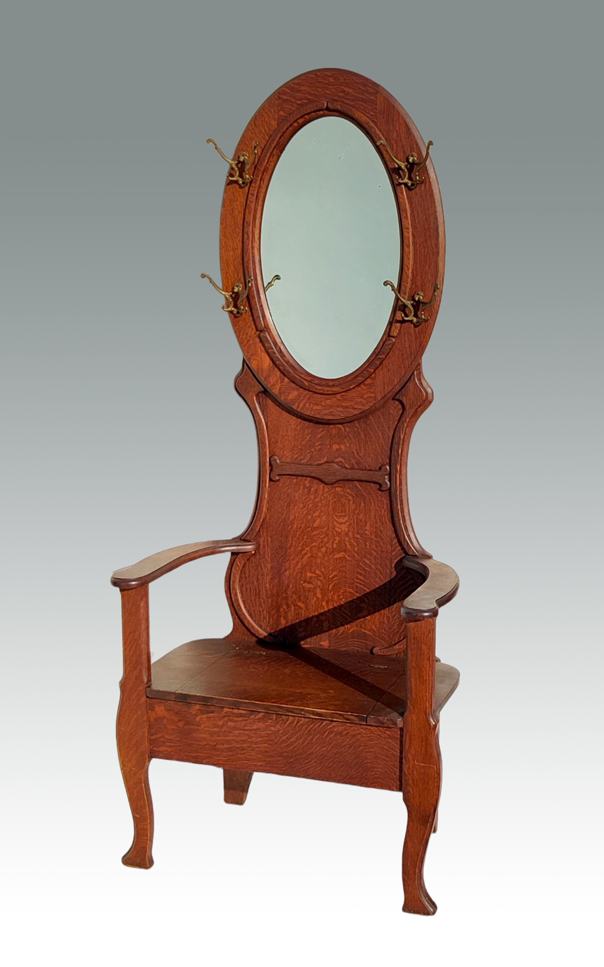 Appraisal: VICTORIAN OAK HALL TREE Having a beveled oval mirror flanked