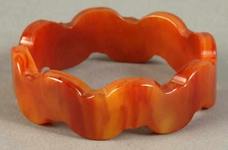 Appraisal: Unusual Bakelite Bracelet with Scallop Border Description In butterscotch and