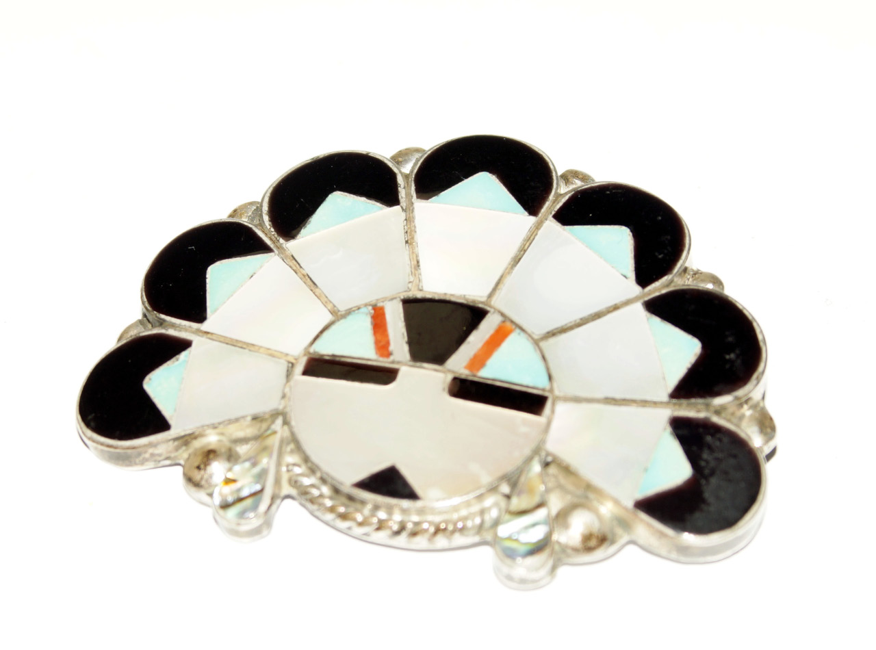 Appraisal: A white metal and enamelled and mother of pearl brooch