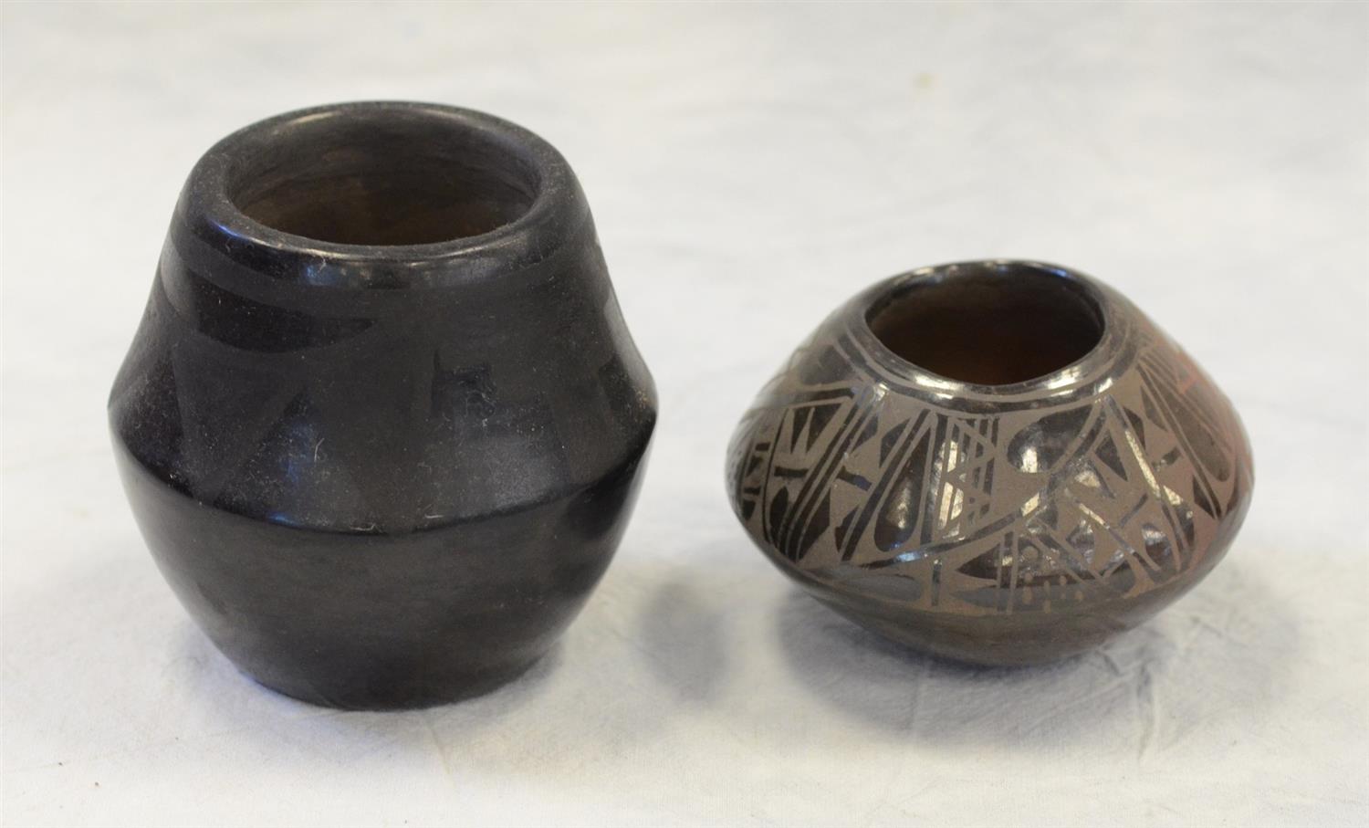 Appraisal: Pieces black on black pottery San Ildefonso vase matte sun