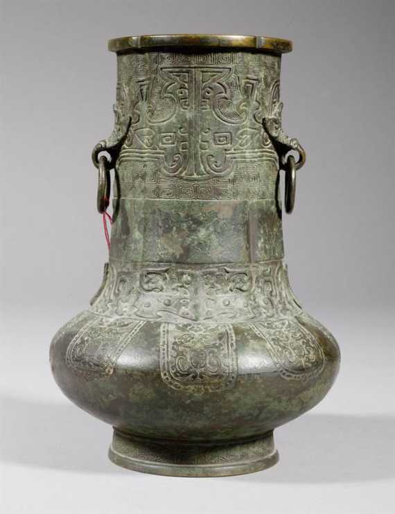 Appraisal: AN ARCHAISTIC BRONZE VASE WITH TAOTIE DESIGN AND WANLI MARK