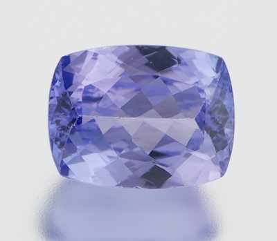 Appraisal: An Unmounted Tanzanite Carat Cushion cut weighting ct