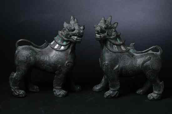 Appraisal: PAIR BURMESE BRONZE FIGURE OF FU LIONS The neck inset