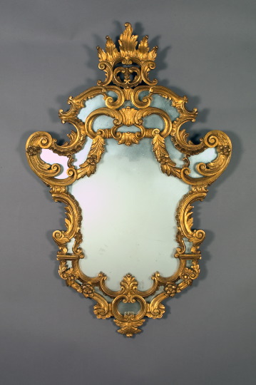 Appraisal: Large Exuberantly Modeled Italian Carved Giltwood Looking Glass in the