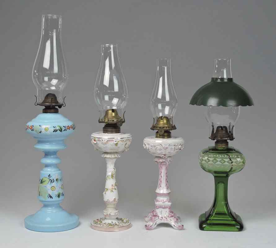 Appraisal: GROUP OF OIL LAMPS Two Dresden type porcelain lamps and