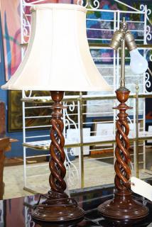 Appraisal: Pair of Baroque style cherry candlesticks each having a spiral