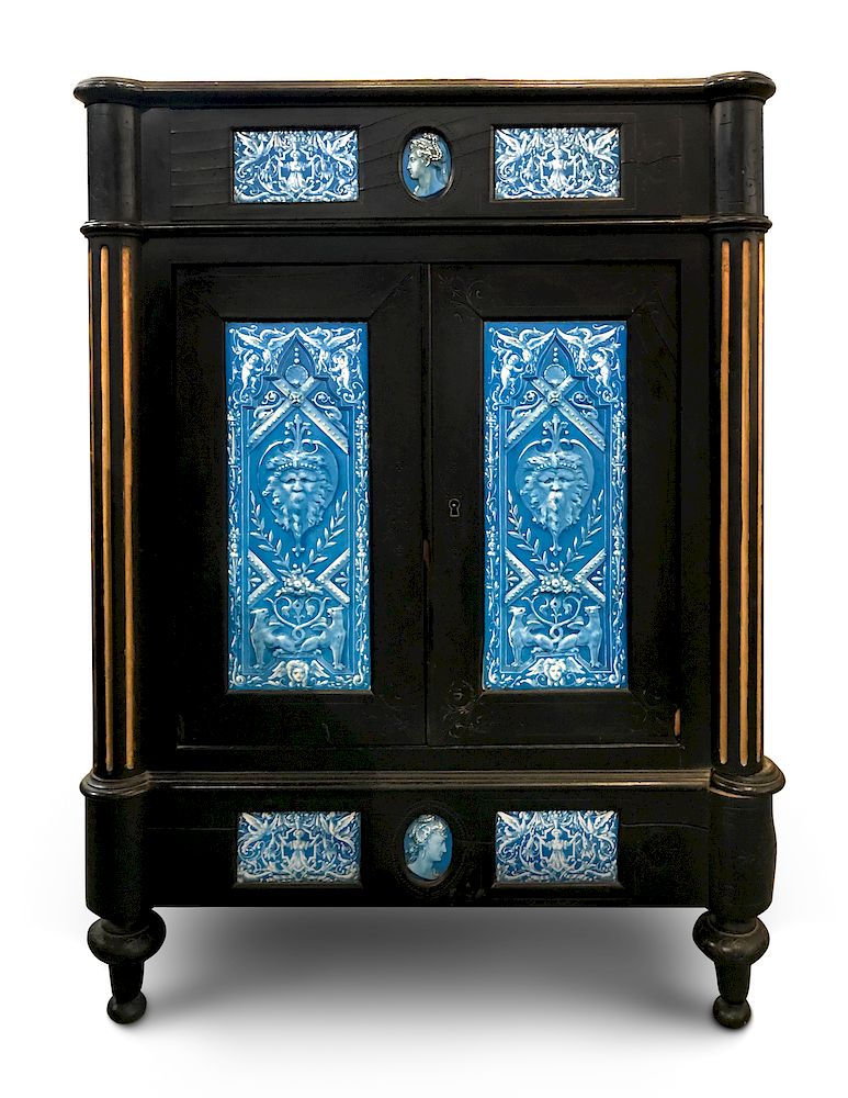 Appraisal: A Continental Blue Faience-Mounted Ebonized Cabinet A Continental Blue Faience-Mounted