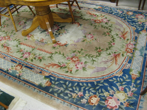 Appraisal: CHINESE CARPET overall floral design on ivory ground and blue