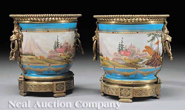 Appraisal: A Pair of Louis XVI-Style Bronze-Mounted Porcelain Jardini res lion