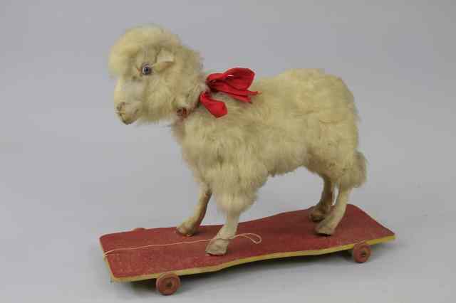 Appraisal: LARGE SHEEP ON PLATFORM Wool covered full figure posed in