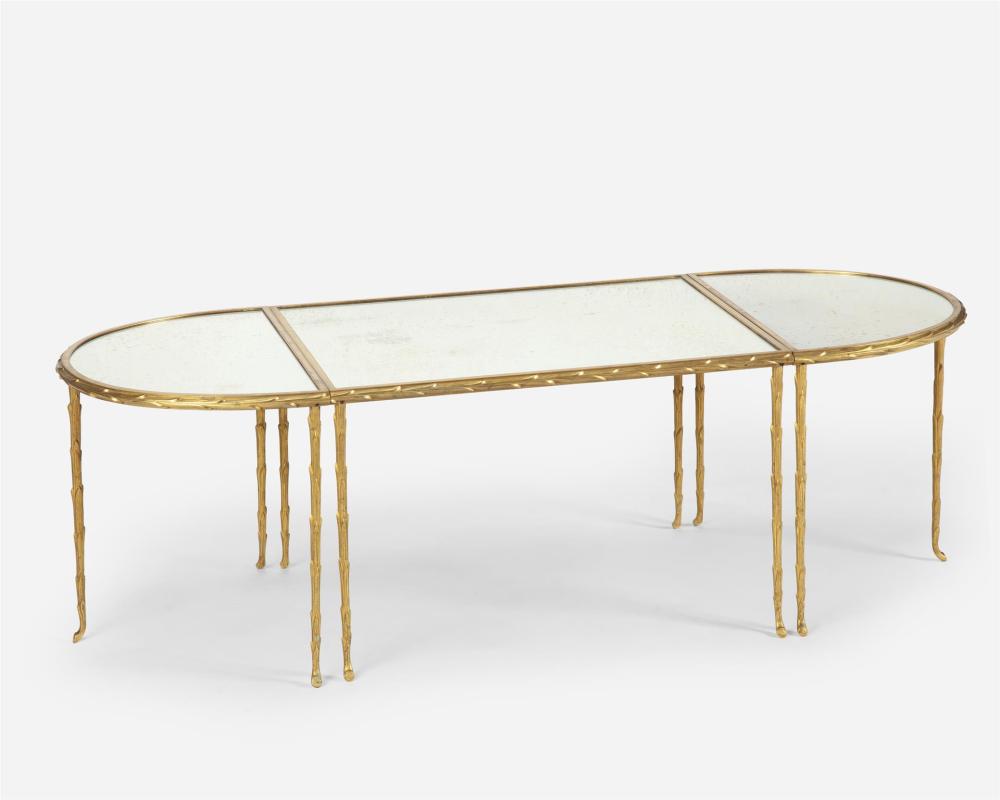 Appraisal: A Hollywood Regency-style mirrored and gilt-bronze coffee table Mid- th