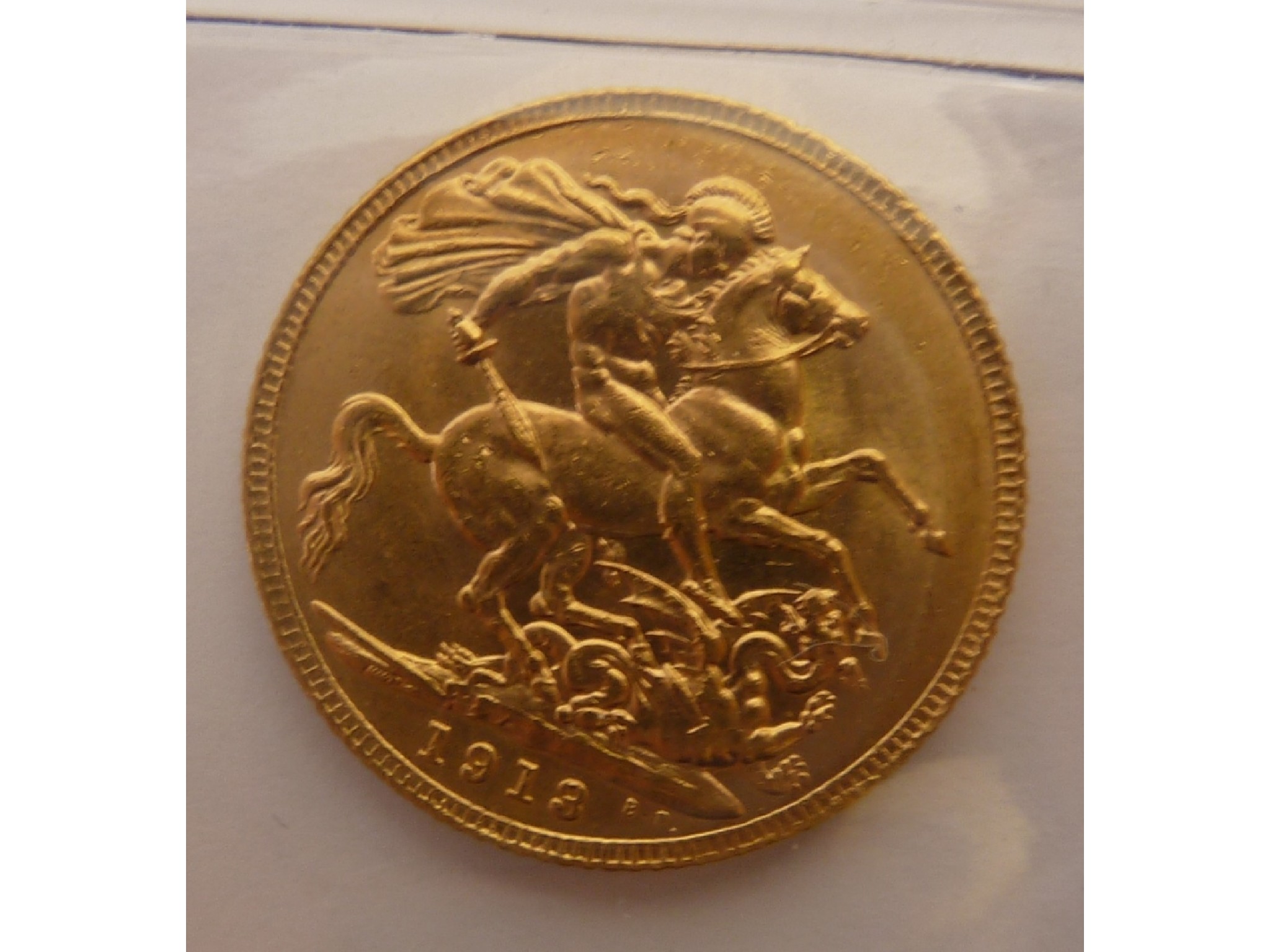 Appraisal: A GEORGE V GOLD SOVEREIGN uncirculated