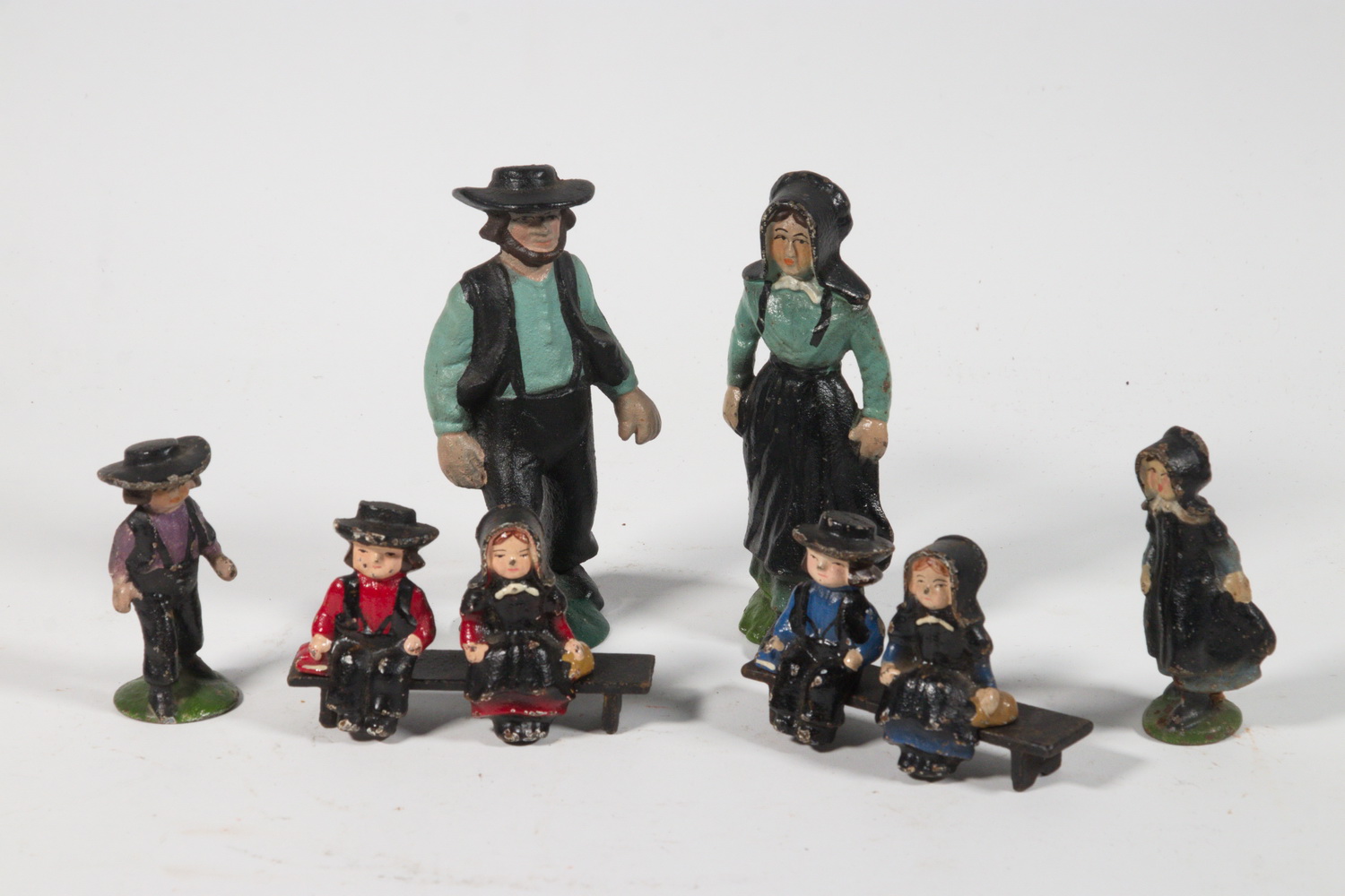 Appraisal: PAINTED CAST IRON AMISH FIGURES PLUS BENCHES Group of Vintage