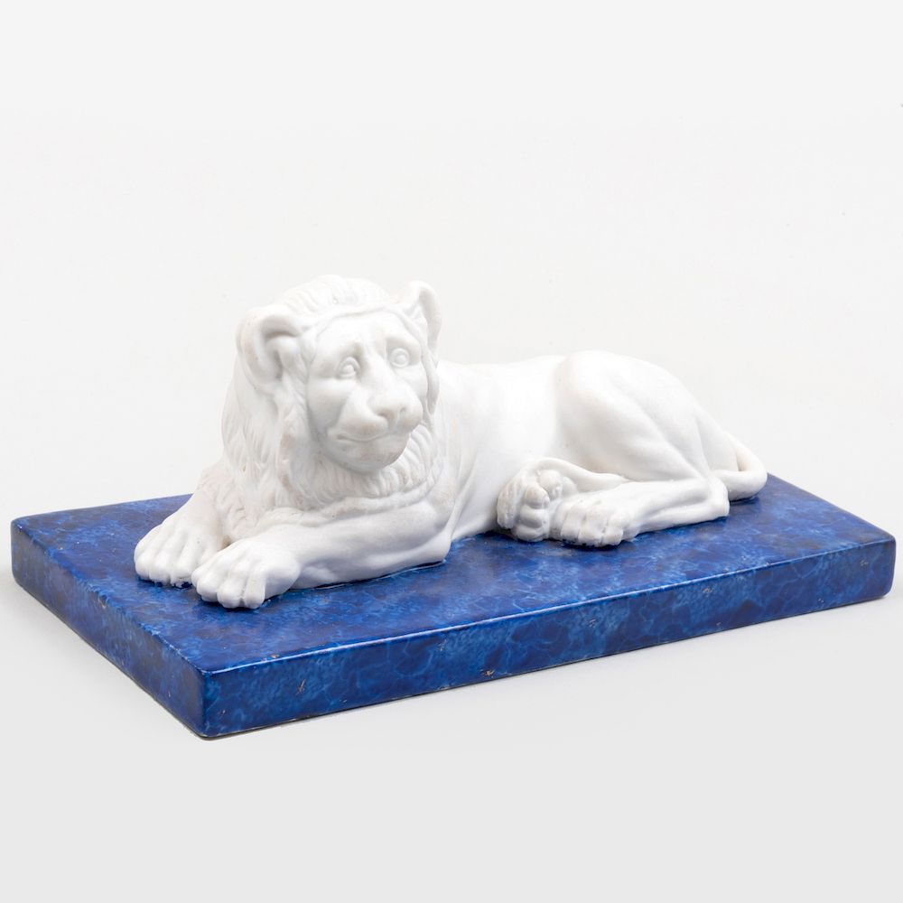 Appraisal: KPM Porcelain Model of a Biscuit Lion on a Faux