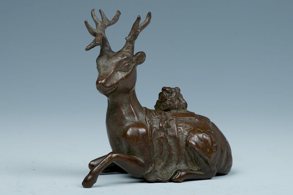 Appraisal: BRONZE DEER PAPER WEIGHT LATE QING TO REPUBLICAN Depicting a