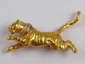 Appraisal: A carat gold brooch designed as a tiger with a