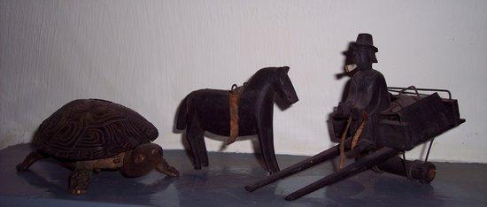 Appraisal: A tortoise table bell and a wooden horse and trap