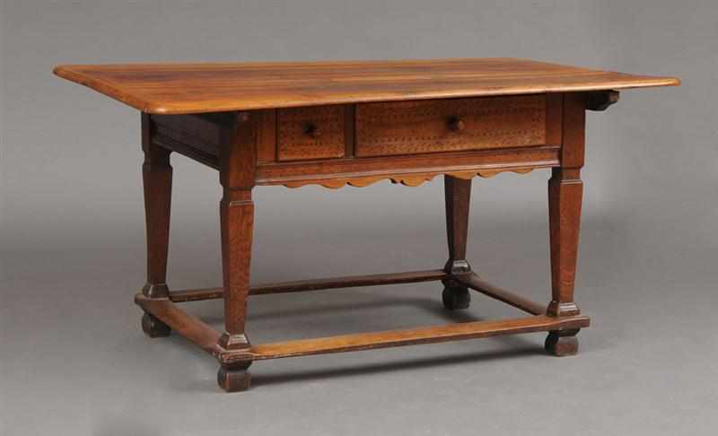 Appraisal: CONTINENTAL BAROQUE WALNUT TOP CARVED OAK SIDE TABLE The overhang