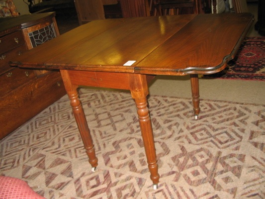 Appraisal: LATE VICTORIAN DROP-LEAF WALNUT DINING TABLE American last quarter of