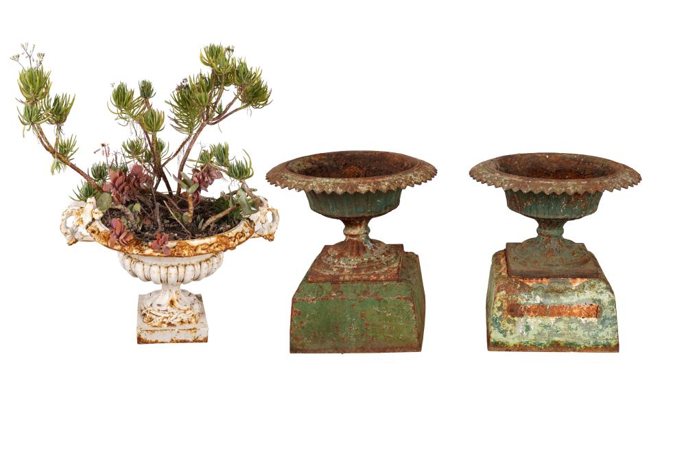 Appraisal: THREE FRENCH PAINTED IRON PLANTERScomprising a pair of green-painted planters