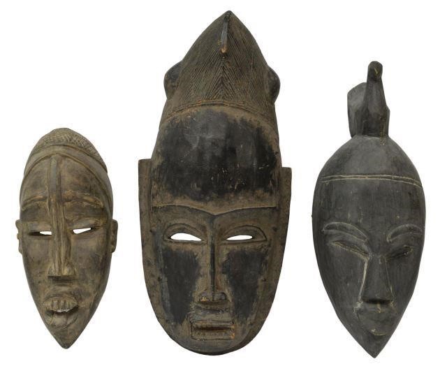 Appraisal: lot of African carved wood masks including face surmounted by