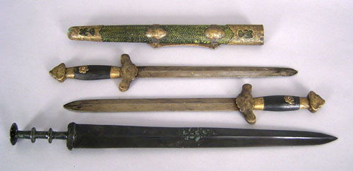 Appraisal: Pair of Asian daggers housed in a shagreen sheath together