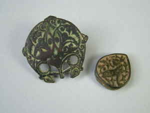 Appraisal: An Indo-Persian bronze belt hook and slide with foliate chased