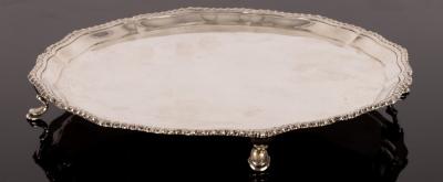 Appraisal: A silver salver London with wavy gadrooned rim on scroll