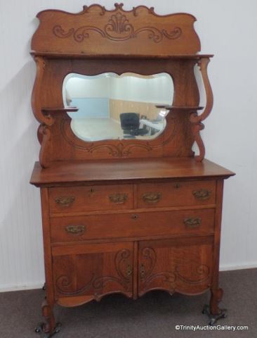 Appraisal: Antique c 's Oak Sideboard w Beveled Mirror Produced by