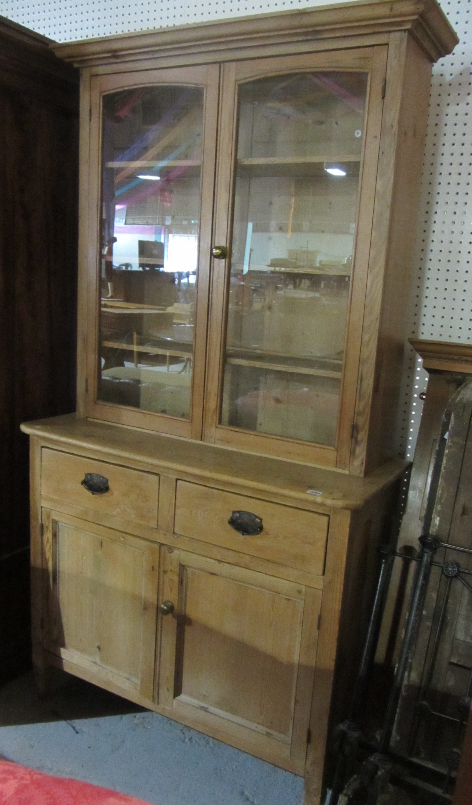 Appraisal: A th century pine bookcase cabinet with a pair of