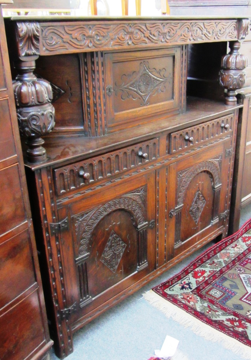 Appraisal: A th century carved oak court cupboard of th century