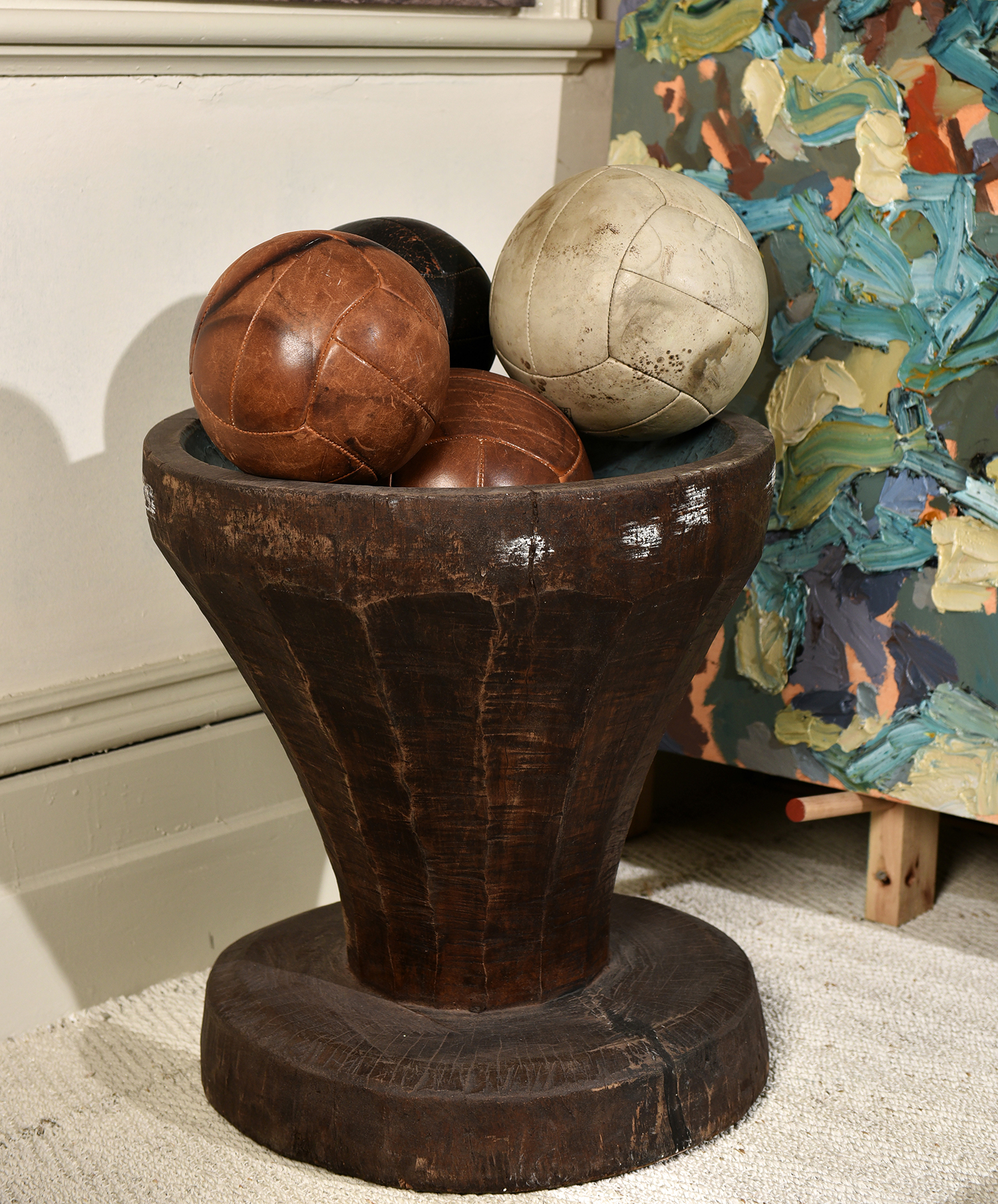 Appraisal: A QUANTITY OF VINTAGE LEATHER MEDICINE BALLS AND A RUSTIC